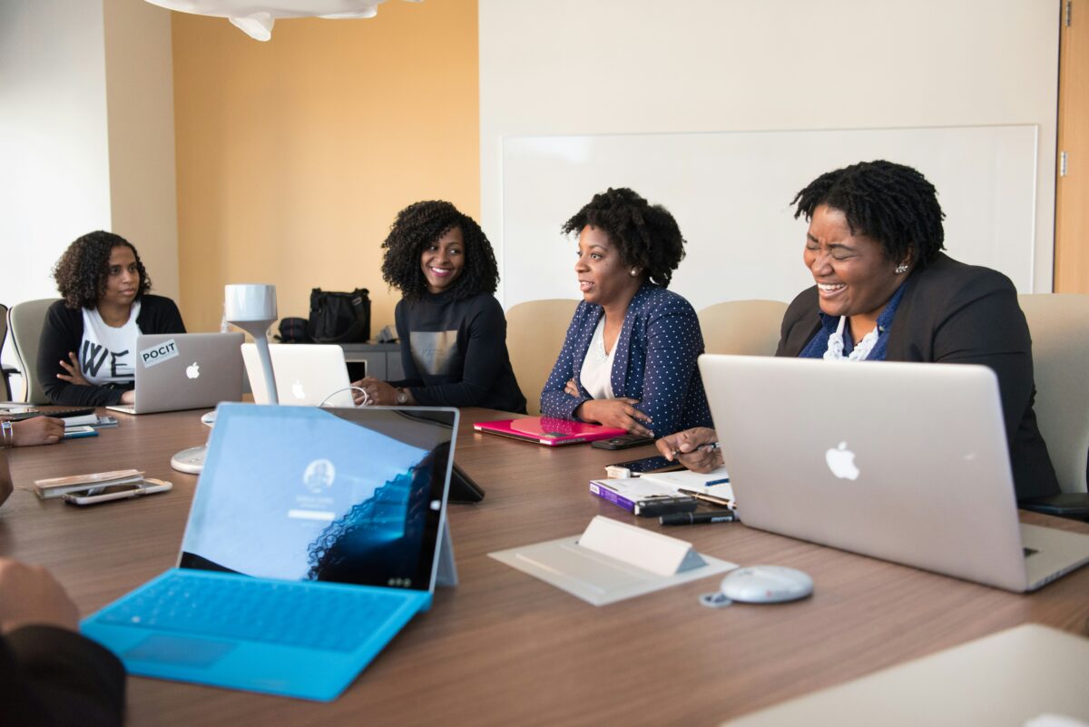 How to Ask for a Letter of Recommendation pictured: Black women workplace meeting