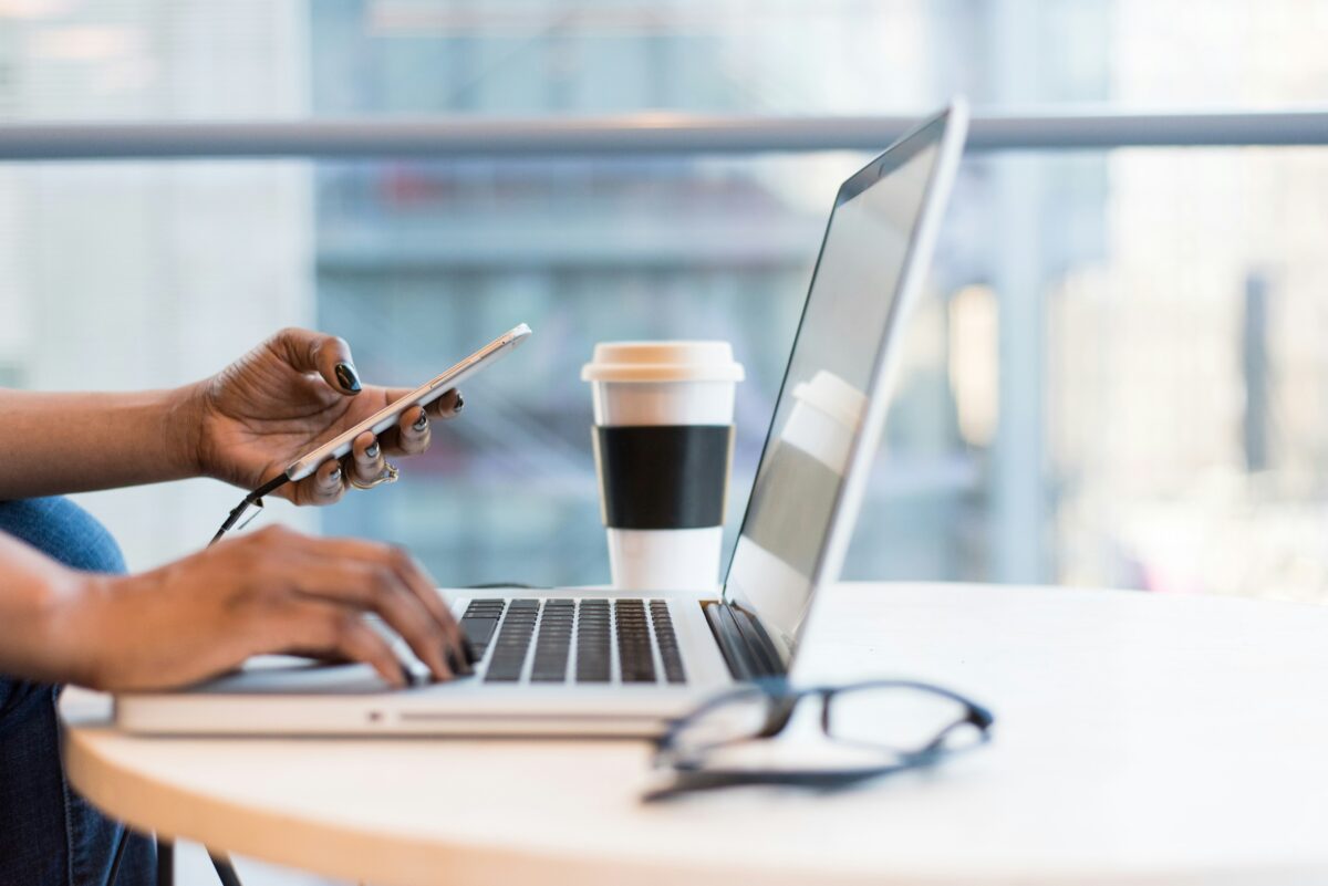 OOO Labor Day Message pictured: person using laptop