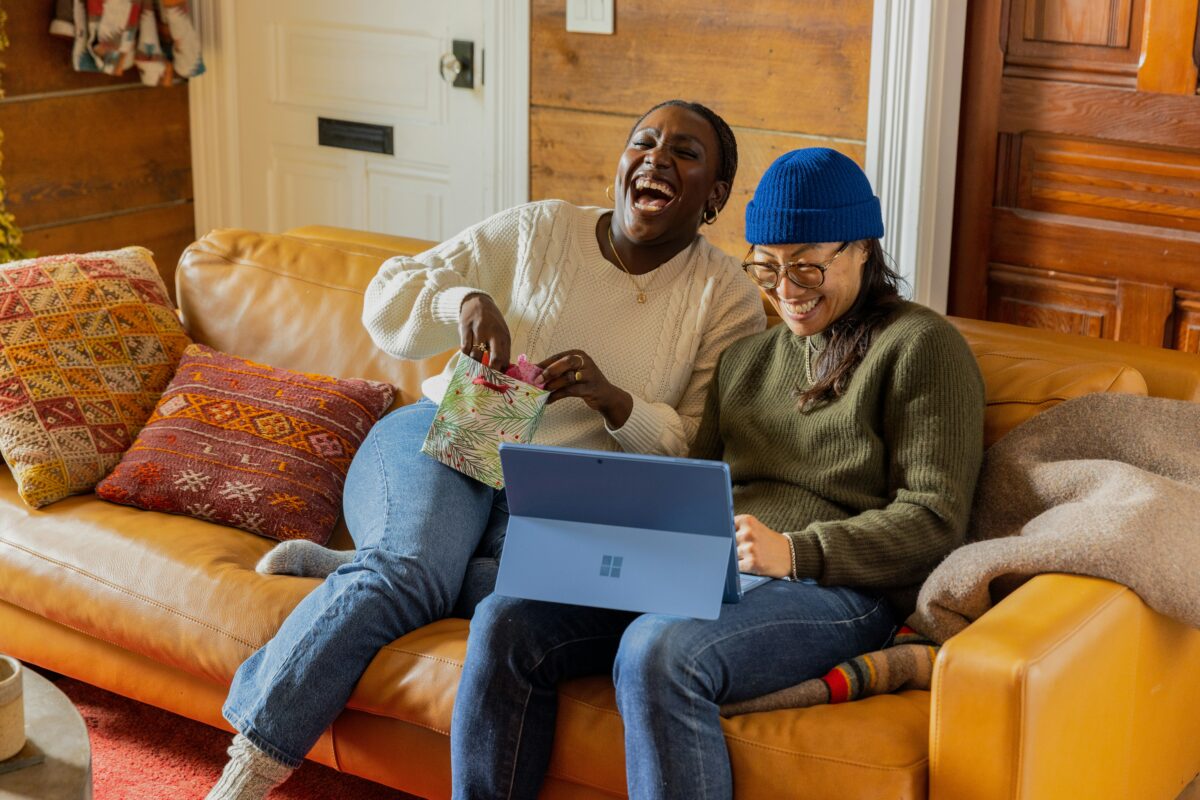 Good Questions to Ask a Mentor pictured: women laughing at laptop