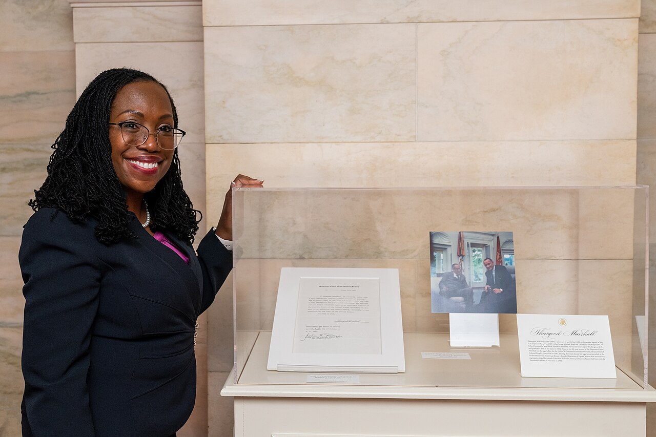 U.S. Supreme Court nominee Judge Ketanji Brown Jackson poses for a photo by a display in the Ground Floor Corridor featuring U.S. Supreme Court Justice Thurgood Marshall, part of a Black History Month exhibit at the White House in partnership with the Smithsonian, Friday, February 25, 2022.